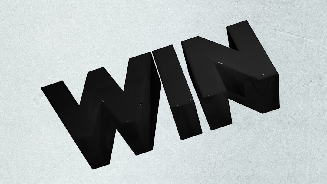 Black 3D letters spelling out the word win