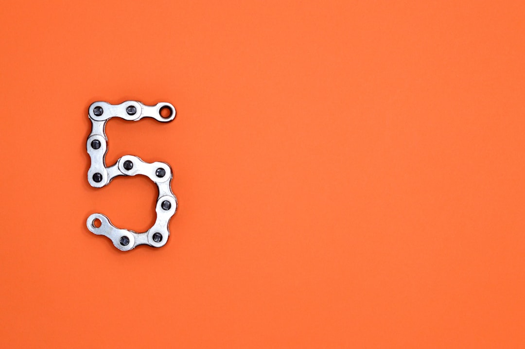 The number five is made of a bicycle chain.